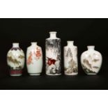 A GROUP OF FIVE CHINESE PORCELAIN SNUFF BOTTLES, of varying shapes, the largest cylindrical,