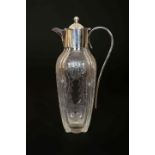 A GEORGE V SILVER-MOUNTED CUT AND FROSTED GLASS CLARET JUG,