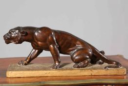 A CONTINENTAL POTTERY MODEL OF A TIGER, with 'bronzed' glaze,