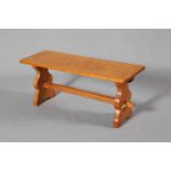 THOMAS WHITTAKER, A GNOMEMAN OAK COFFEE TABLE, of refectory form, with carved gnome signature.