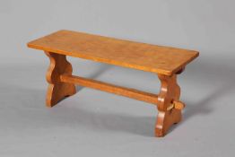 THOMAS WHITTAKER, A GNOMEMAN OAK COFFEE TABLE, of refectory form, with carved gnome signature.