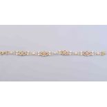 A SEED PEARL AND ENAMEL BRACELET, circa 1920,