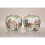 A PAIR OF CHINESE FAMILLE ROSE JARS, each enamel painted with figures at a table taking tea. 12.