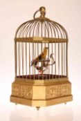 A SINGING BIRD AUTOMATON, LATE 19TH/EARLY 20TH CENTURY, in gilt wirework cage,