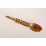 A CARVED JADE SPOON, with painted gilt decoration.