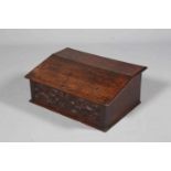 AN OAK BIBLE BOX, LATE 17TH/EARLY 18TH CENTURY, with hinged slope and carved front.