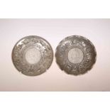 TWO CHINESE WHITE METAL COIN DISHES,