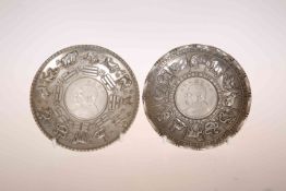 TWO CHINESE WHITE METAL COIN DISHES,