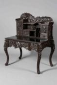 A CHINESE LACQUERED DESK, with superstructure with cupboards and compartments,