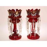 A PAIR OF 19TH CENTURY RUBY GLASS TABLE LUSTRES, each with crown top and enamel painted.