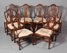A SET OF EIGHT SHIELD-BACK MAHOGANY DINING CHAIRS, including a pair of carvers,