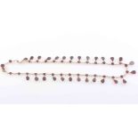 AN EARLY VICTORIAN GARNET AND SEED PEARL NECKLACE,