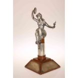 A SILVER FIGURAL TROPHY, the wooden stand with four plaques and collar hallmarked for Adie Brothers,