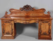 A WILLIAM IV MAHOGANY PEDESTAL SIDEBOARD, with boldly scrolling backboard with foliate carved crest,
