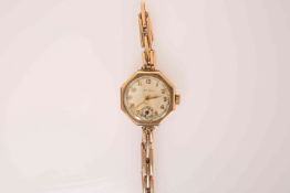 A VINTAGE ROLEX 9 CARAT GOLD LADY'S 9 WRISTWATCH, with octagonal case, signed Rolex and Henderson,