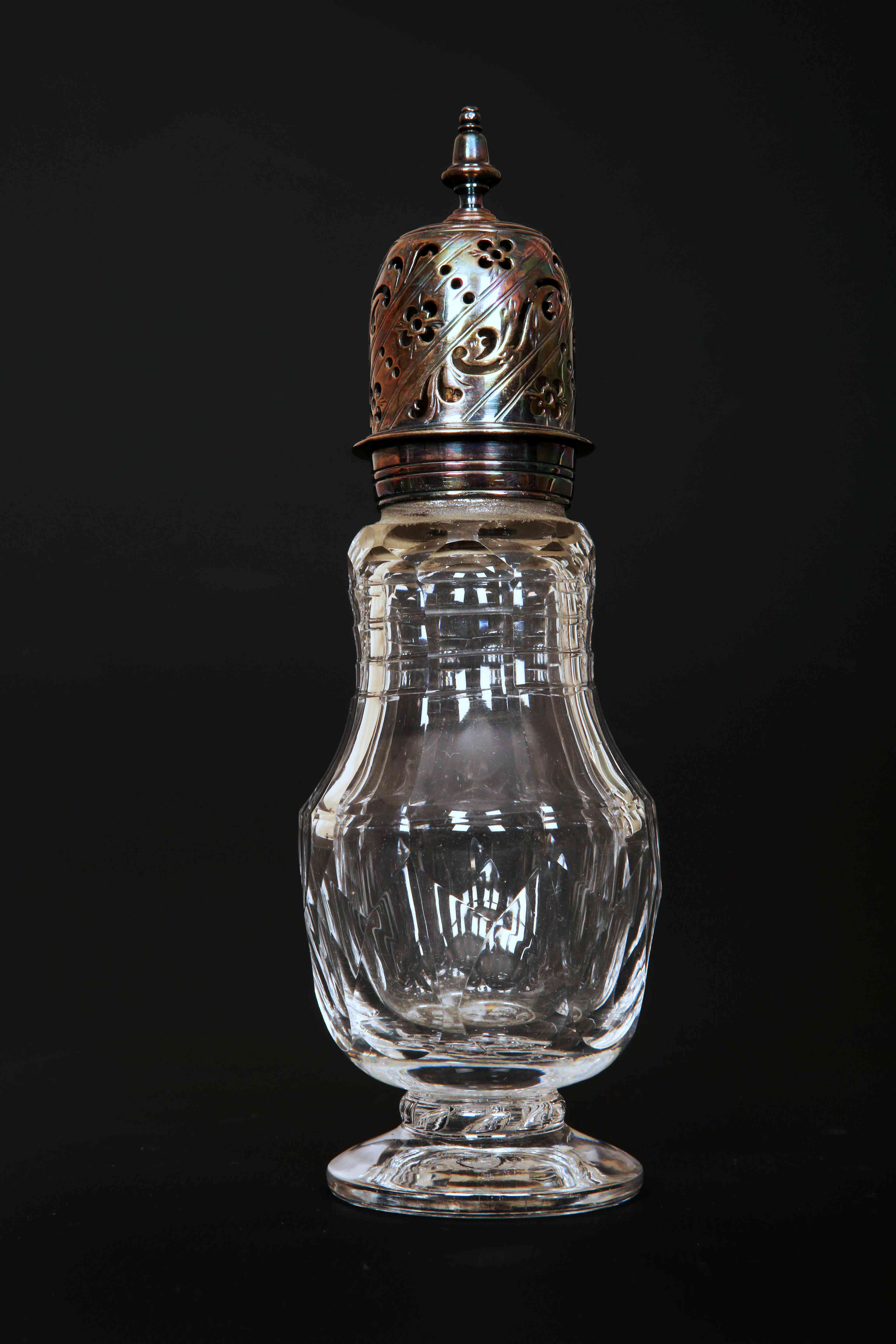 A GEORGE III CUT-GLASS AND SILVER SPICE CASTER OR MUFFINEER, circa 1800,