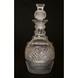 A LATE GEORGIAN CUT-GLASS DECANTER, with thistle stopper. 26.