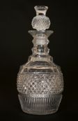 A LATE GEORGIAN CUT-GLASS DECANTER, with thistle stopper. 26.