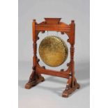 A LATE VICTORIAN MAHOGANY DINNER GONG, with architectural crest, no beater. 93.