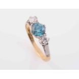 A BLUE ZIRCON AND DIAMOND RING,