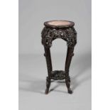 A LARGE CHINESE MARBLE-INSET HARDWOOD JARDINIERE STAND, carved and pierced with foliage,