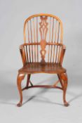 A YEW WOOD AND ELM WINDSOR CHAIR, with double pierced splat and crinoline stretcher.