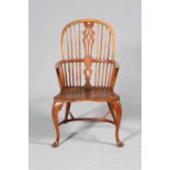 A YEW WOOD AND ELM WINDSOR CHAIR, with double pierced splat and crinoline stretcher.