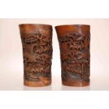 A PAIR OF CHINESE CARVED BAMBOO BRUSH POTS, 19th CENTURY, modelled to resemble tusks,