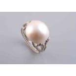 A BLISTER PEARL RING,