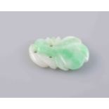 A JADEITE PLAQUE, of simple carved form. Length 2cm. Weight 1.3gms.