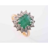 AN EMERALD AND DIAMOND RING,