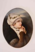 A GERMAN PORCELAIN PLAQUE, LATE 19th CENTURY, oval, painted with a young girl in white bonnet,