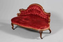 A SMALL VICTORIAN WALNUT AND UPHOLSTERED SETTEE, CIRCA 1870,