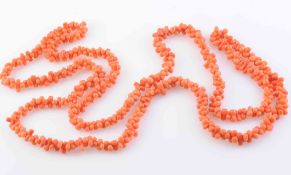 A CORAL NECKLACE, of multi coral strands strung into a twisted formation. Length 50cm. Weight 56.