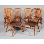 A SET OF SIX ELM WHEELBACK WINDSOR CHAIRS, including a pair of carvers,