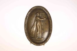 A 19TH CENTURY BRONZE PLAQUE, oval, cast with Apollo playing the lyre. 16.5cm by 11.