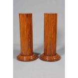 A PAIR OF ART DECO WALNUT PEDESTALS, of lobed circular outline, raised on triple stepped bases.