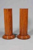 A PAIR OF ART DECO WALNUT PEDESTALS, of lobed circular outline, raised on triple stepped bases.