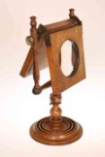 A 19TH CENTURY MAHOGANY ZOGRASCOPE, with baluster turned stem.
