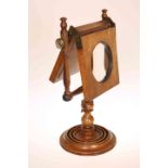 A 19TH CENTURY MAHOGANY ZOGRASCOPE, with baluster turned stem.