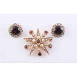 A GARNET AND SEED PEARL BROOCH, circa 1890-1900, formed as a five-pointed star,