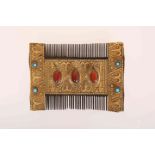 A GILT-METAL MOUNTED HAND-CUT WOODEN COMB, POSSIBLY TURKMENISTAN, circa 1900, double sided,