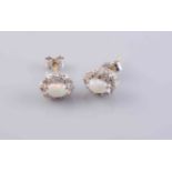 A PAIR OF OPAL AND DIAMOND EARRINGS,