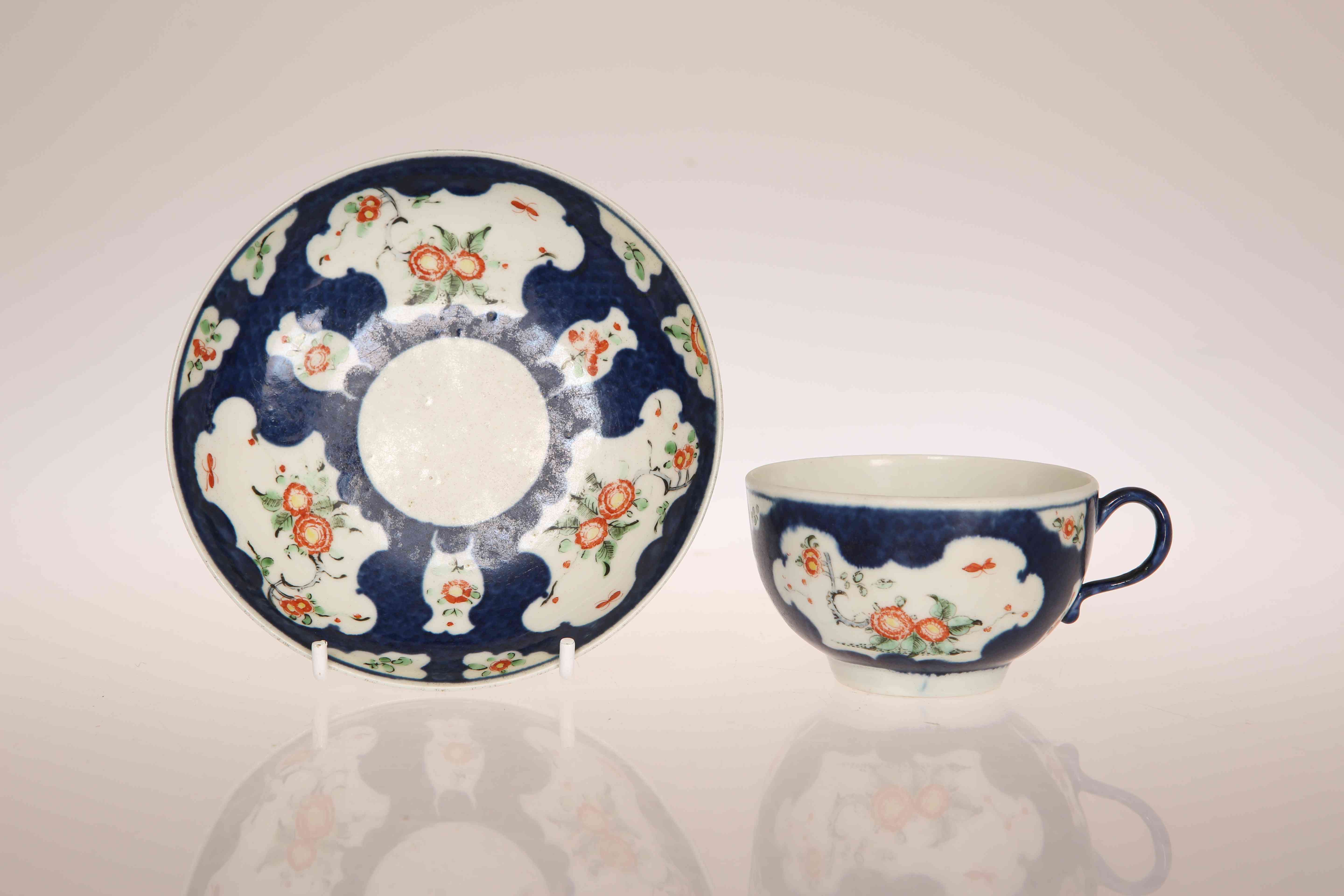 A WORCESTER SCALE BLUE GROUND CUP AND SAUCER, CIRCA 1770,