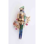 AN ENAMEL, DIAMOND AND RUBY BROOCH, modelled as an exotic bird perched on a branch,