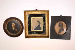 A GEORGIAN PORTRAIT MINIATURE OF A GENTLEMAN, watercolour on paper, in a verre eglomise frame,
