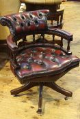 Captains style deep buttoned ox blood leather swivel desk chair
