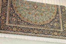 Keshan carpet with a green ground 2.30 by 1.