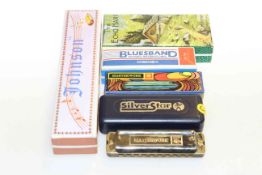 Collection of six harmonicas