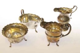 Silver sauce boat, two silver cream jugs and a silver sugar bowl (4) 11.